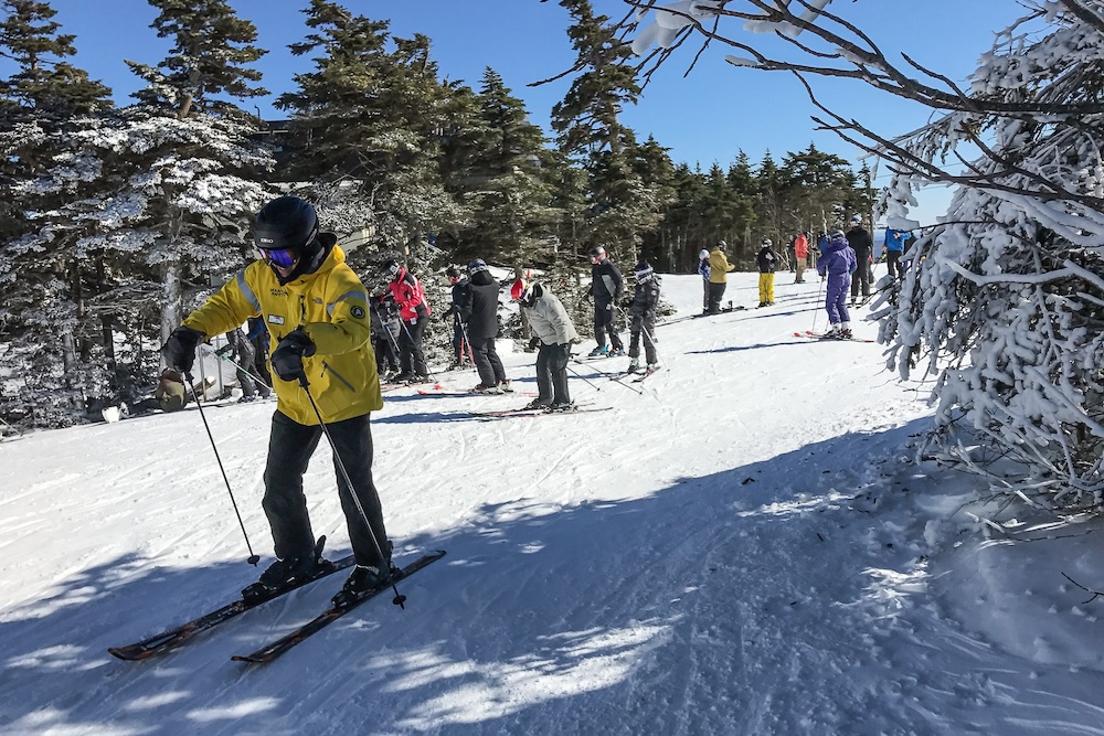 large group of people skiing together